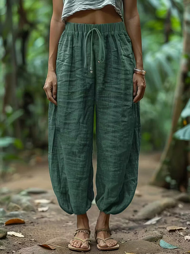 Women wearing green harem pants in a natural setting