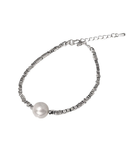 Silver bracelet with a pearl on a white background