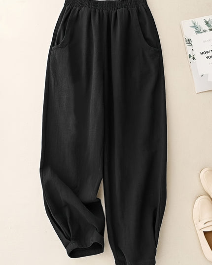 Black wide-leg pants on a light beige background