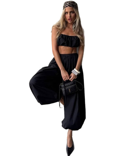 Woman wearing a black outfit with a white background