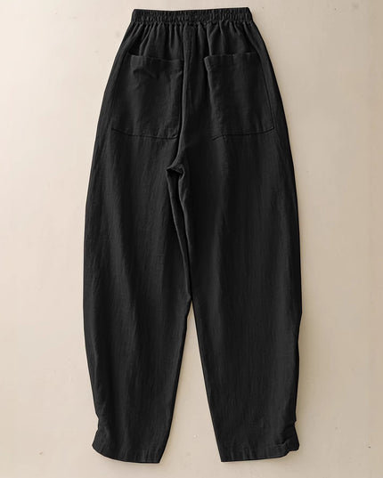 Black pants on a beige background