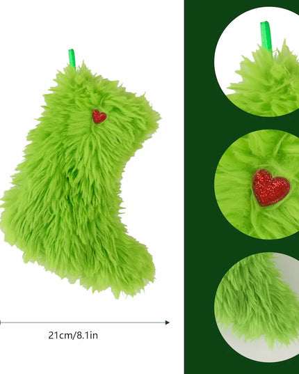 A bright lime green fluffy Christmas stocking with a small red glittery heart accent, shown on a white background with dimension arrows indicating 25 cm height and 21 cm width. A dark green panel on the right shows three circular close-ups of the fluffy texture and the red heart detail.