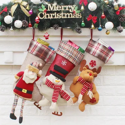 Collection of three Chistmas stockings on a Christmas tree