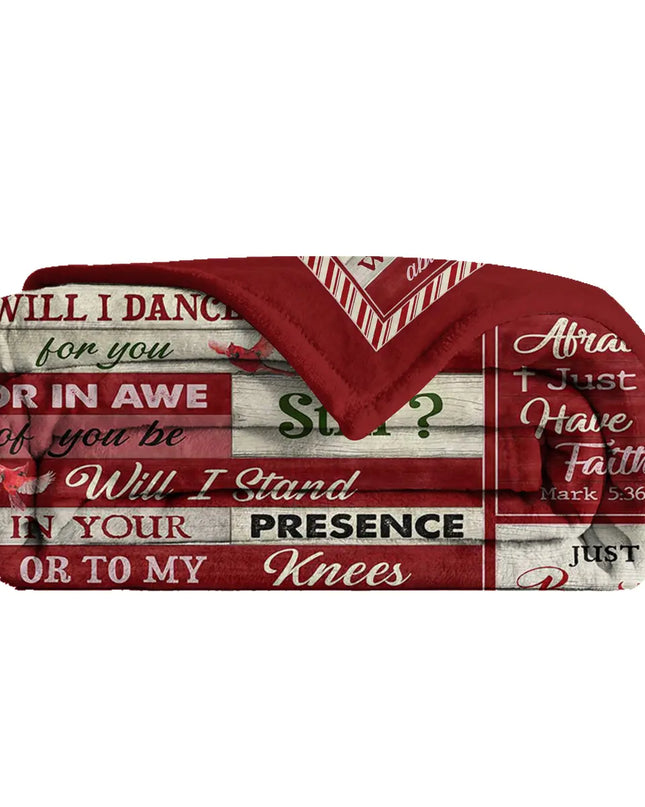 Folded red Christmas design thro blanket on white background