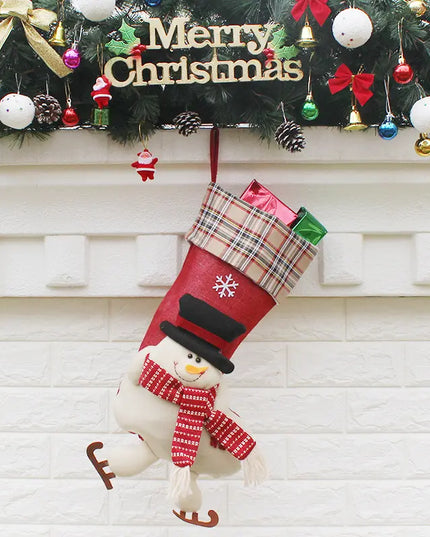 Christmas stocking with snowman design hanging on a fireplace mantle decorated with festive ornaments.