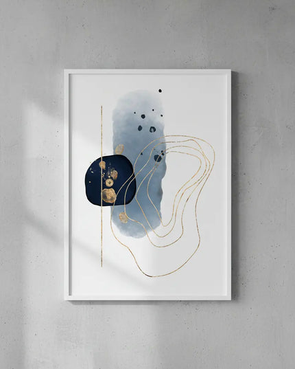 Abstract art print with blue and gold elements in a white frame on a gray wall.
