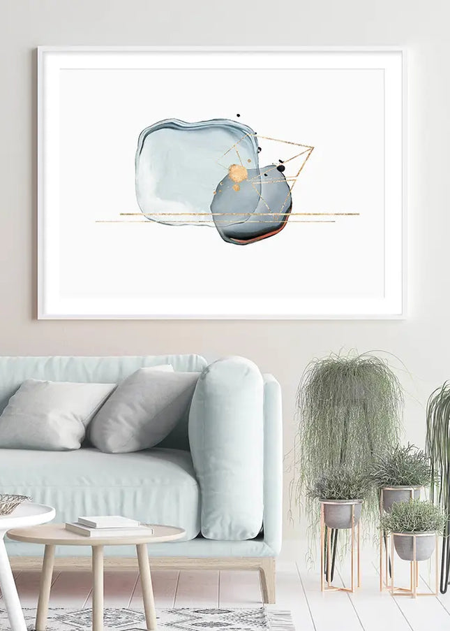 Modern living room with a light blue sofa, decorative plants, and a framed abstract art piece on the wall.