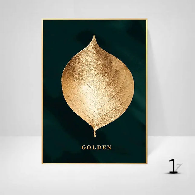 Framed artwork of a gold leaf on a dark green background with 'GOLDEN' text.