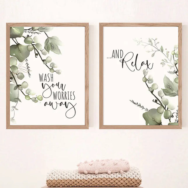 Two framed prints with greenery and text on a white wall.