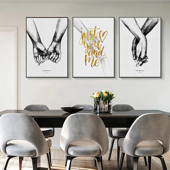 Dining room with a table and chairs, featuring wall art of hands holding and text 'Just You and Me'.