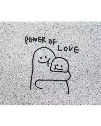 Doormat with 'Power of Love' text and cartoon characters hugging on a textured background