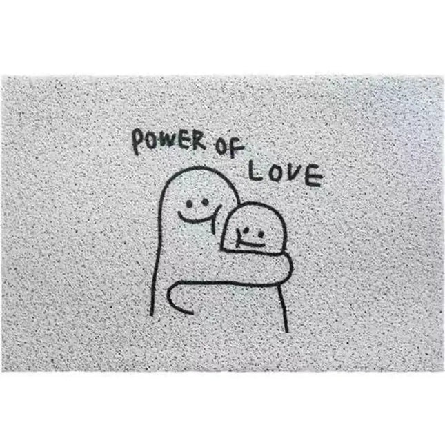 Doormat with 'Power of Love' text and cartoon characters hugging on a textured background