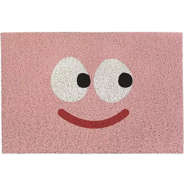 Pink doormat with a smiley face design on a white background