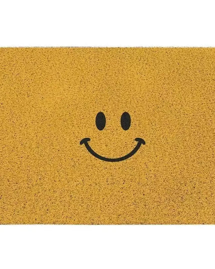 Yellow doormat with a black smiley face design on a white background