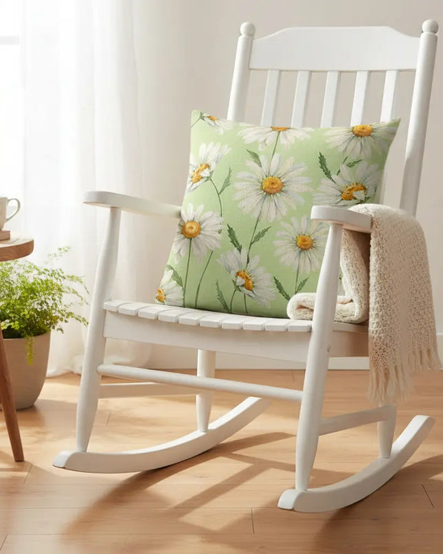 White rocking chair with a floral pillow in a bright room