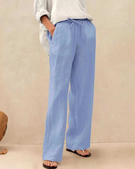 Person wearing light blue pants with a neutral background