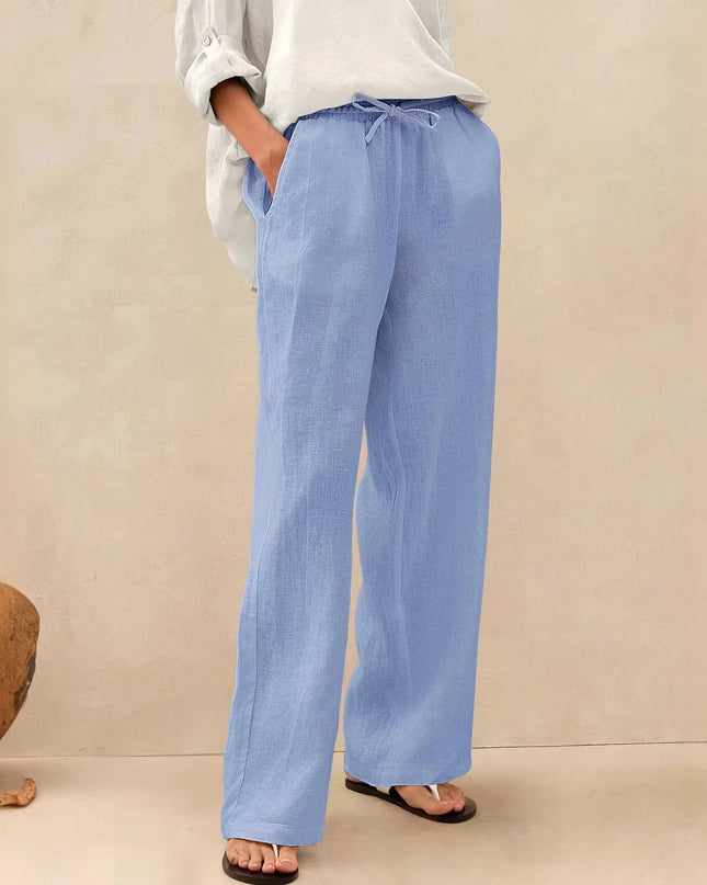 Person wearing light blue pants with a neutral background