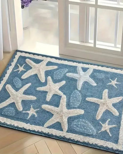 Blue rug with white starfish patterns on a wooden floor.