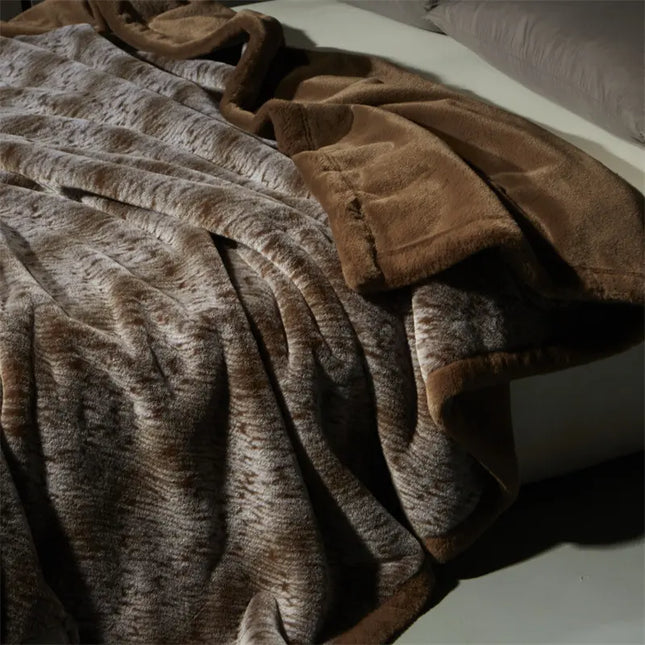 Brown textured blanket draped over a surface