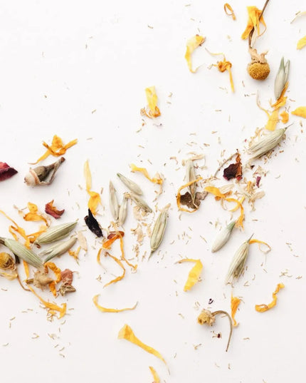 Dried botanicals in Herbal Bath Tea – oats, chamomile, rose petals and calendula flat lay