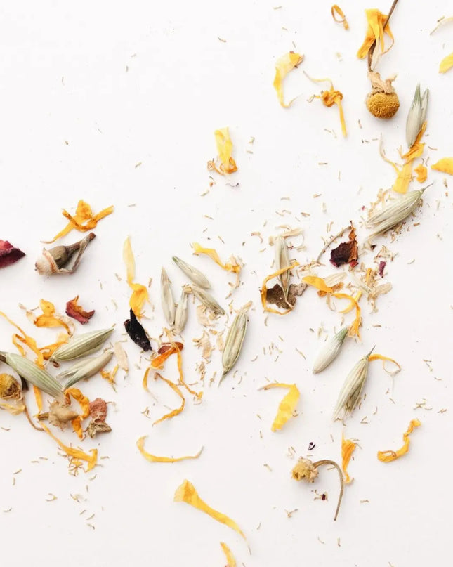 Dried botanicals in Herbal Bath Tea – oats, chamomile, rose petals and calendula flat lay