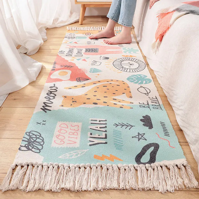 Colorful children's rug with animal illustrations on a wooden floor.