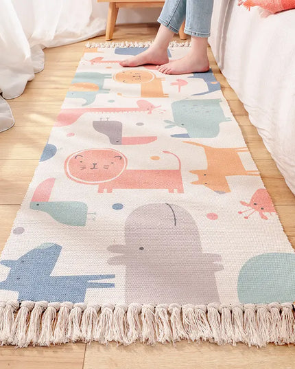 Children's room with a colorful animal-patterned rug on a wooden floor.