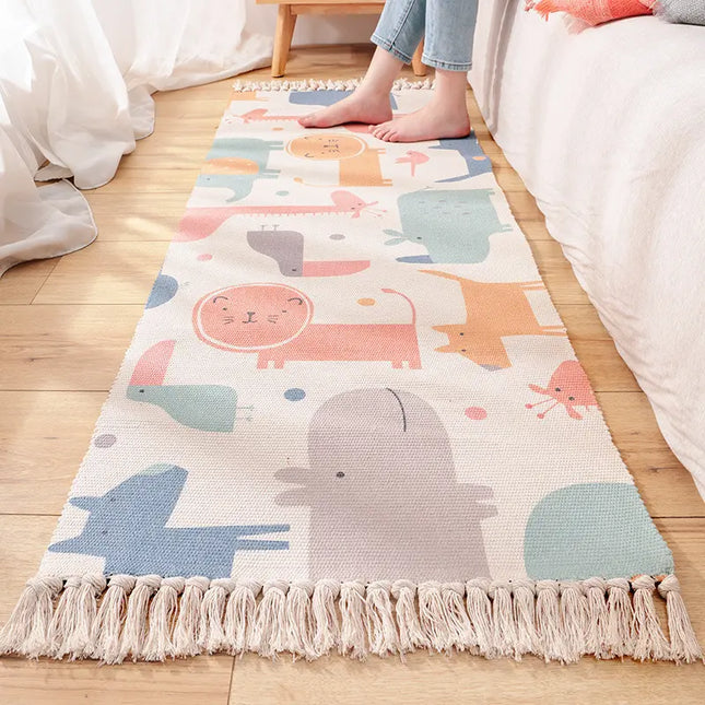 Children's room with a colorful animal-patterned rug on a wooden floor.