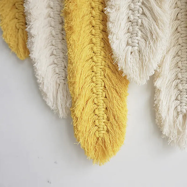 Close-up of textured yellow and beige fabric on a white background