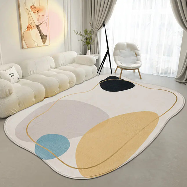Modern living room with a colorful abstract rug, white sofa, and decorative elements.