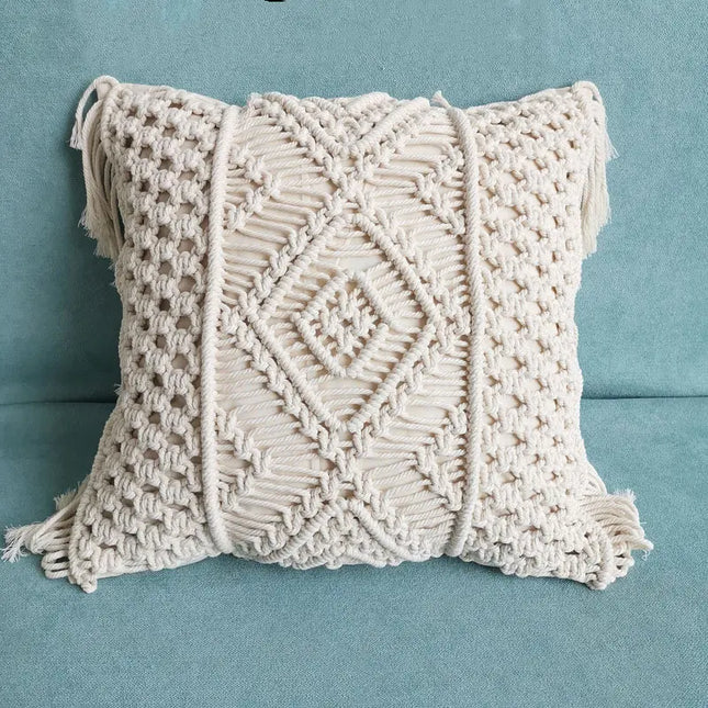 Macrame pillow with fringe on a blue background