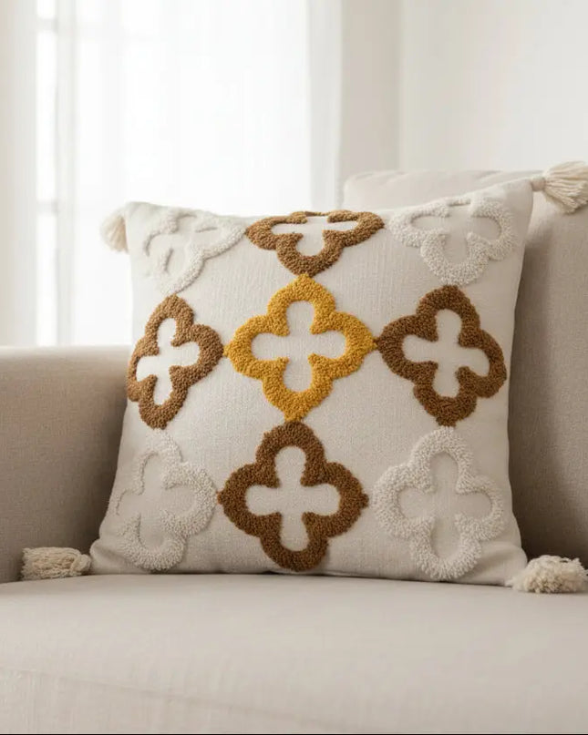 Decorative pillow with geometric pattern on a beige sofa
