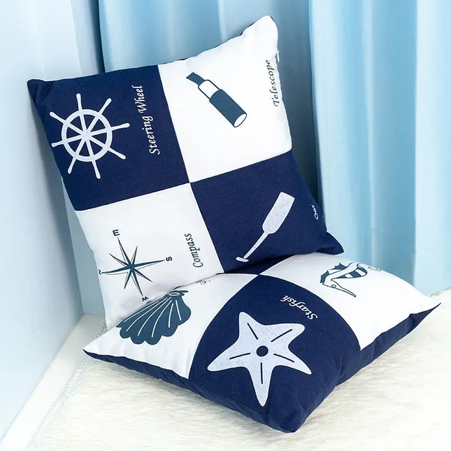Nautical-themed decorative pillows with symbols on a light blue background