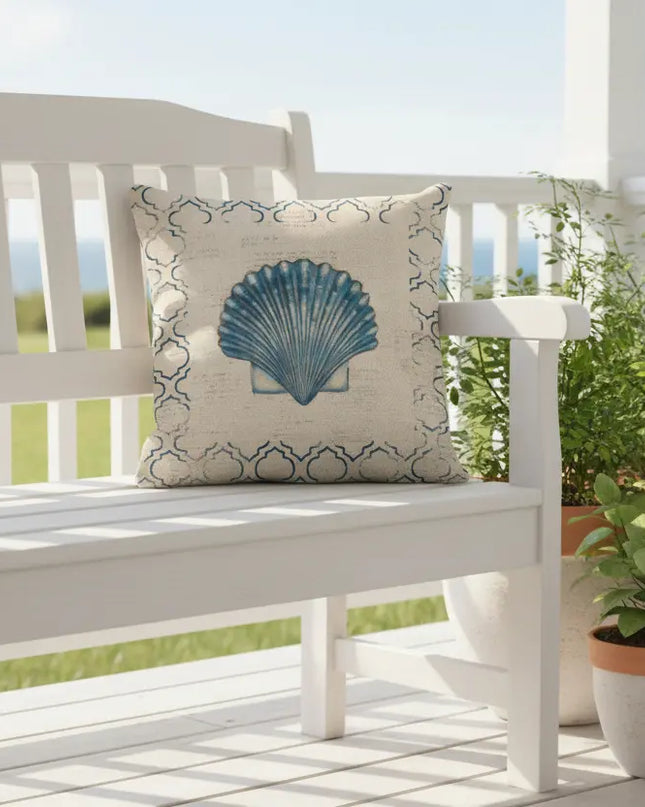 White bench with a decorative pillow featuring a blue shell design on a porch with plants.