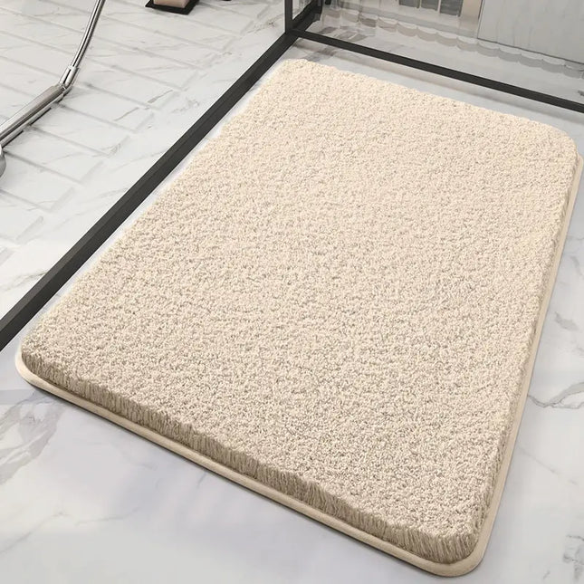 Beige fluffy bath mat on a marble floor