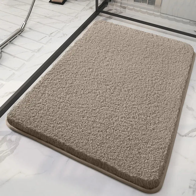 Dark beige fluffy bath mat on a marble floor