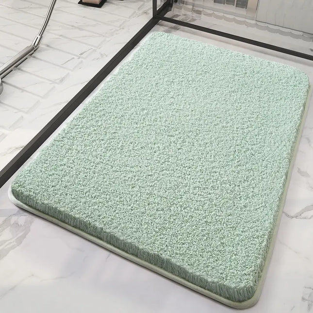 Green fluffy bath mat on a marble floor