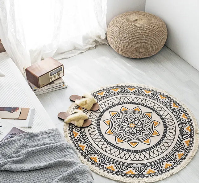 Round decorative rug with mandala pattern on a light wooden floor.