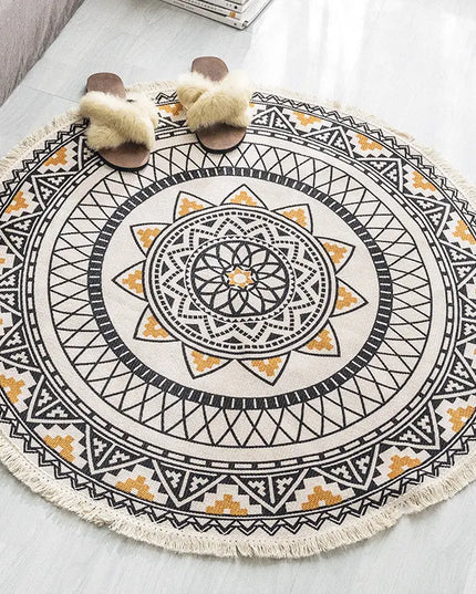 Round decorative rug with geometric pattern on a light-colored floor.