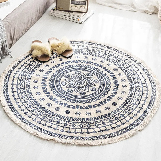 Round blue and white patterned rug on a white floor with slippers nearby.