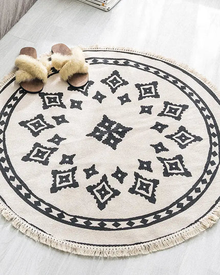 Round patterned rug with tassels on a light-colored floor