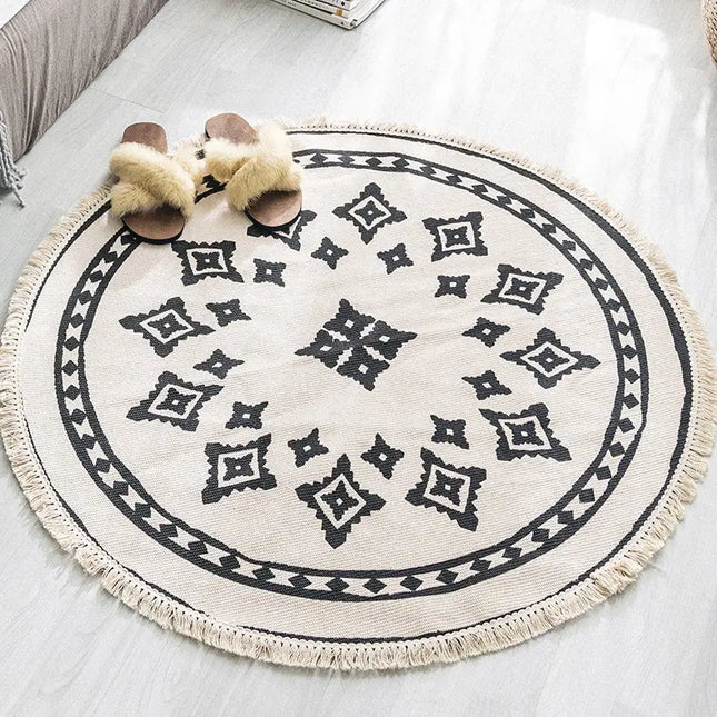 Round patterned rug with tassels on a light-colored floor