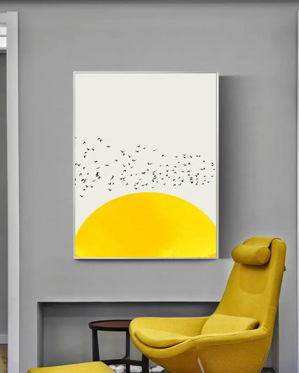 Poster with yellow rising sun and flying birds on a gray wall