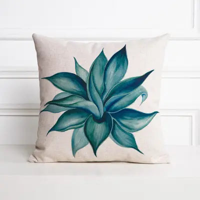 Decorative pillow with a blue succulent design on a white background