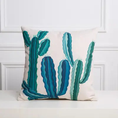 Decorative pillow with cactus design on a white background