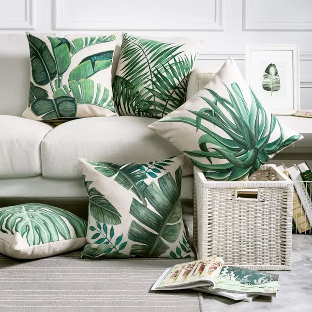 Living room with tropical leaf-patterned cushions on a sofa